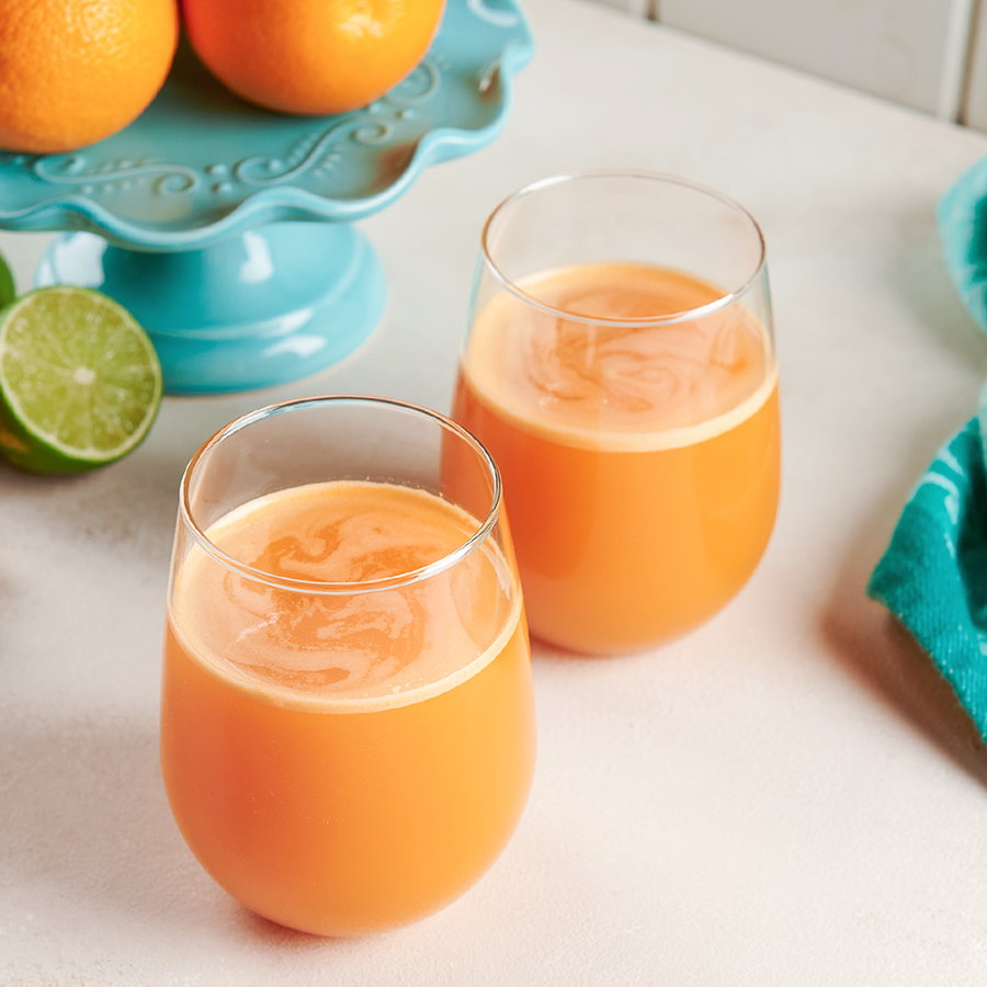 vitamin c juice recipe on a white table with lime 