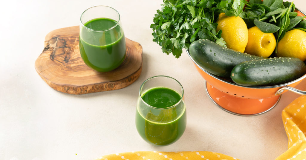 parsley lemon juice recipe for weight loss with ingredients on a white table