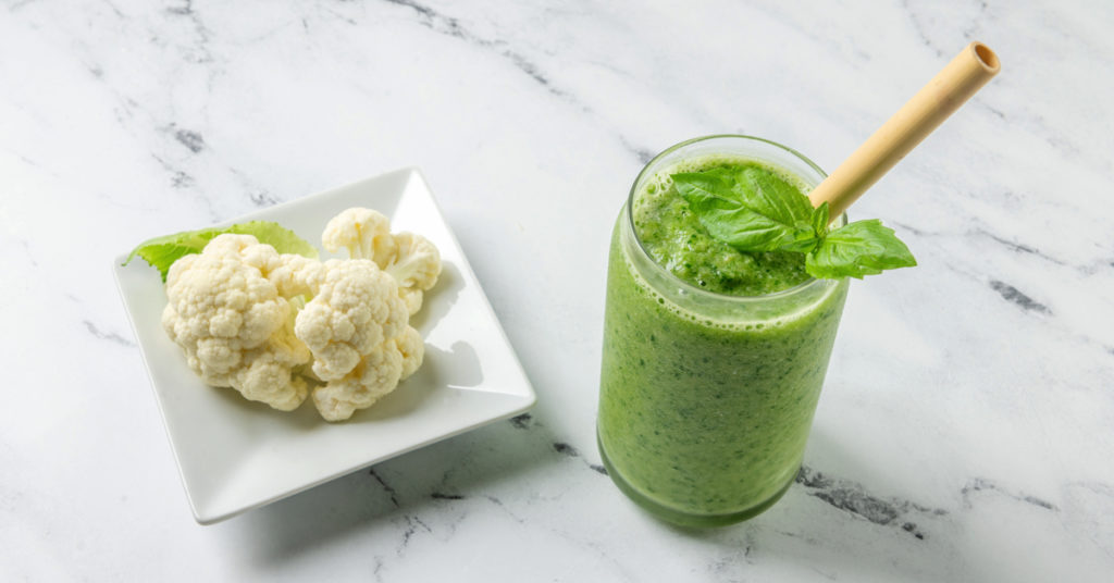 cauliflower green smoothie on a marble counter
